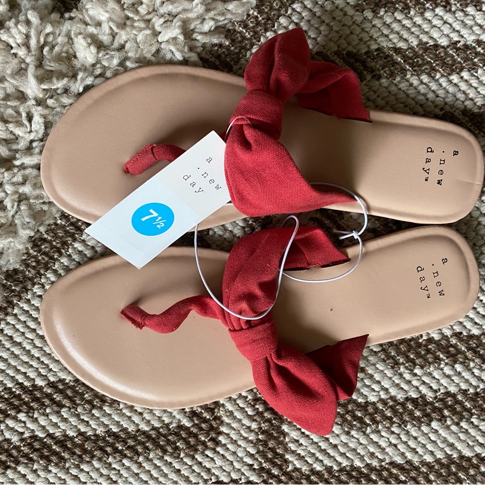 Coral pink bow flip flops